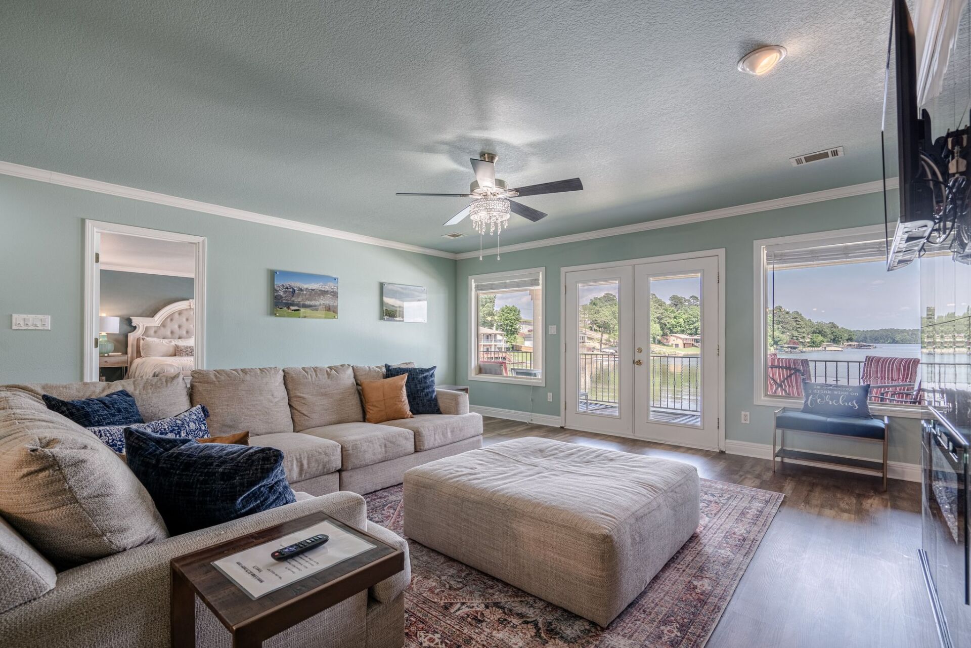 A living room filled with furniture and a ceiling fan.