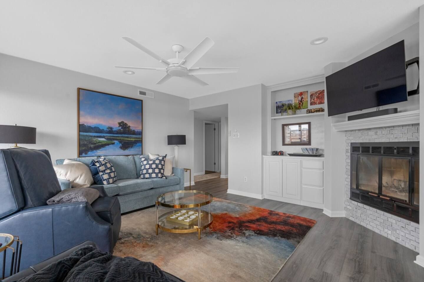 A living room filled with furniture and a fireplace.
