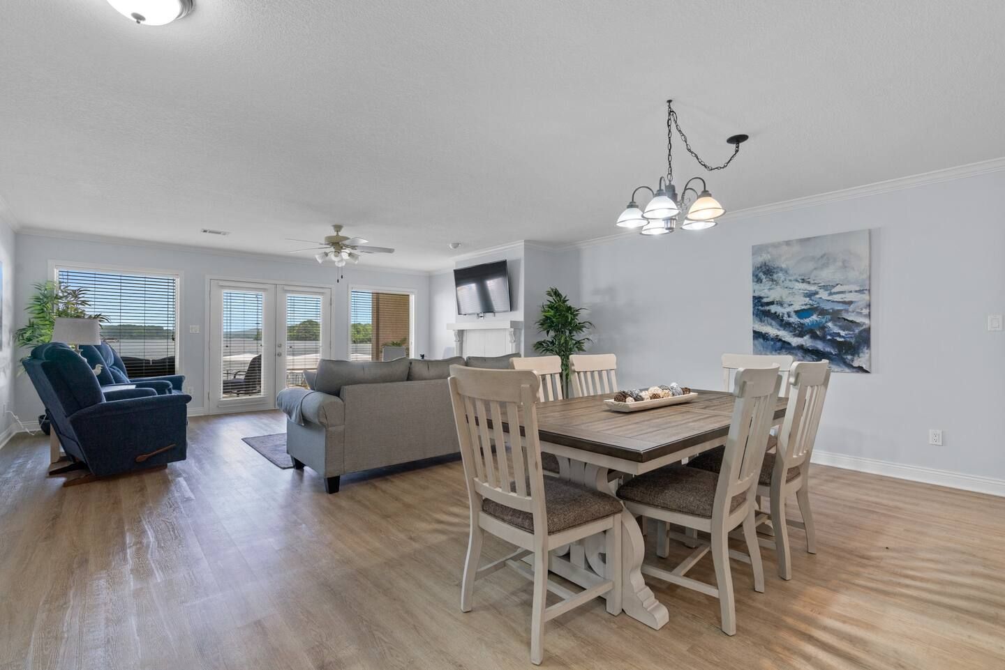 There is a dining table and chairs in the middle of the room.