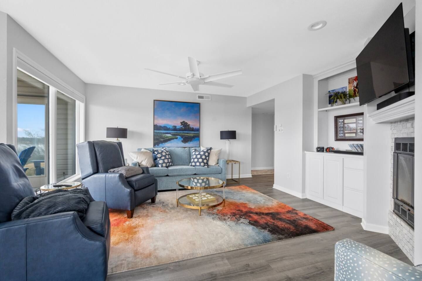 A living room filled with furniture and a television.