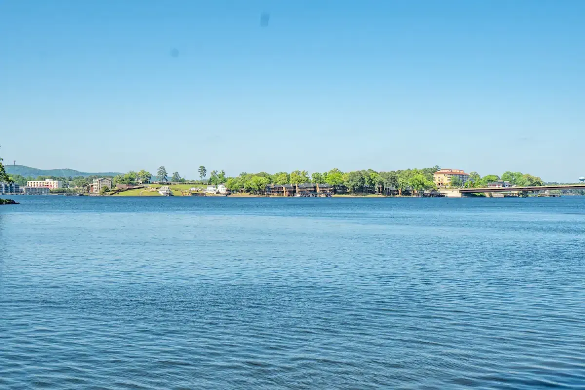 A large body of water with a small island in the middle of it.
