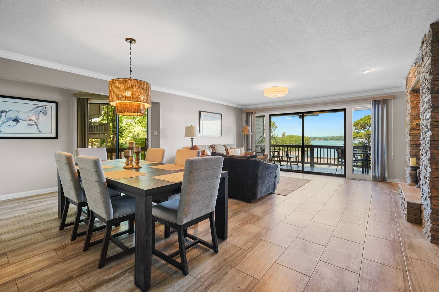 There is a dining table and chairs in the middle of the room.