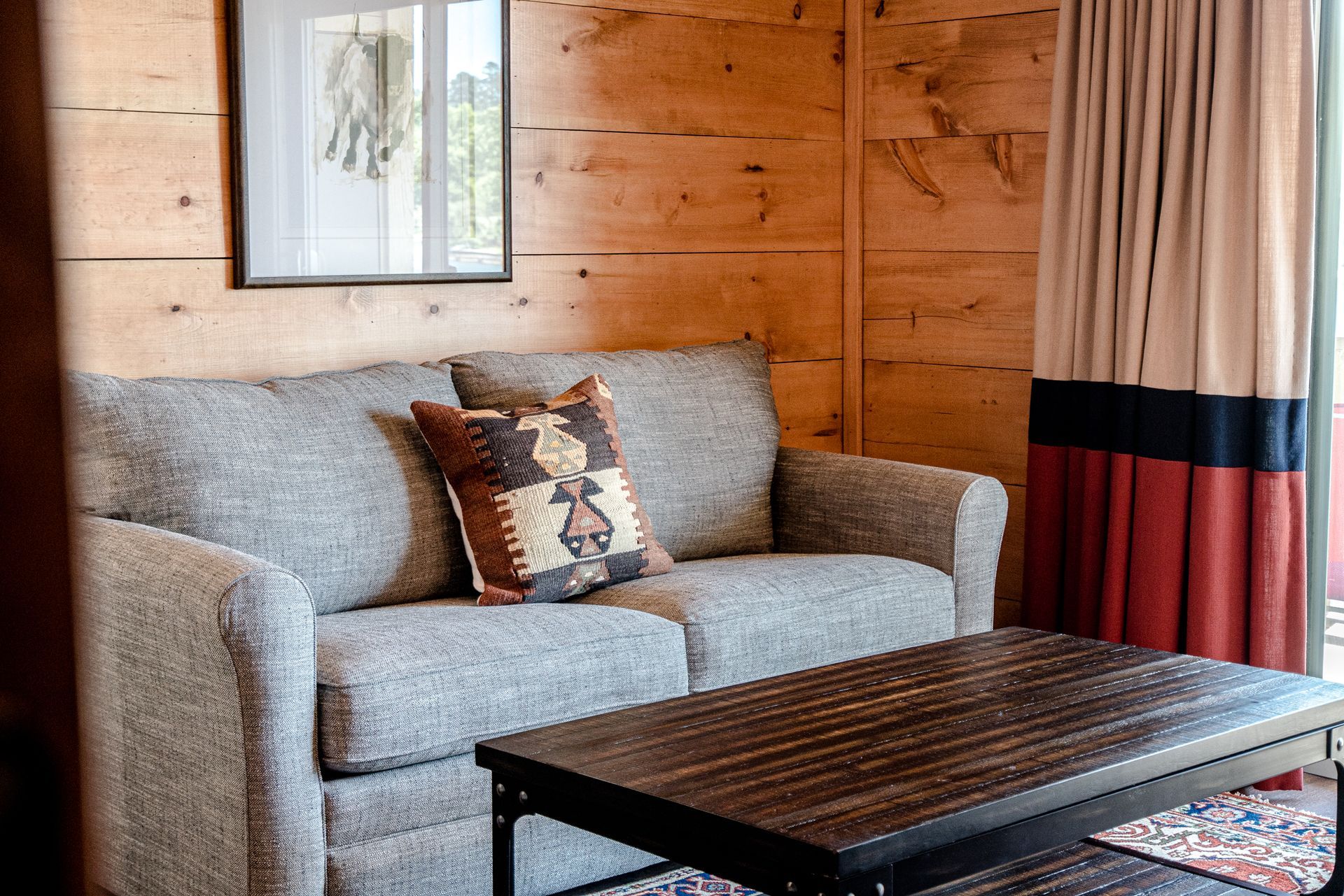 There is a couch and a coffee table in the living room.