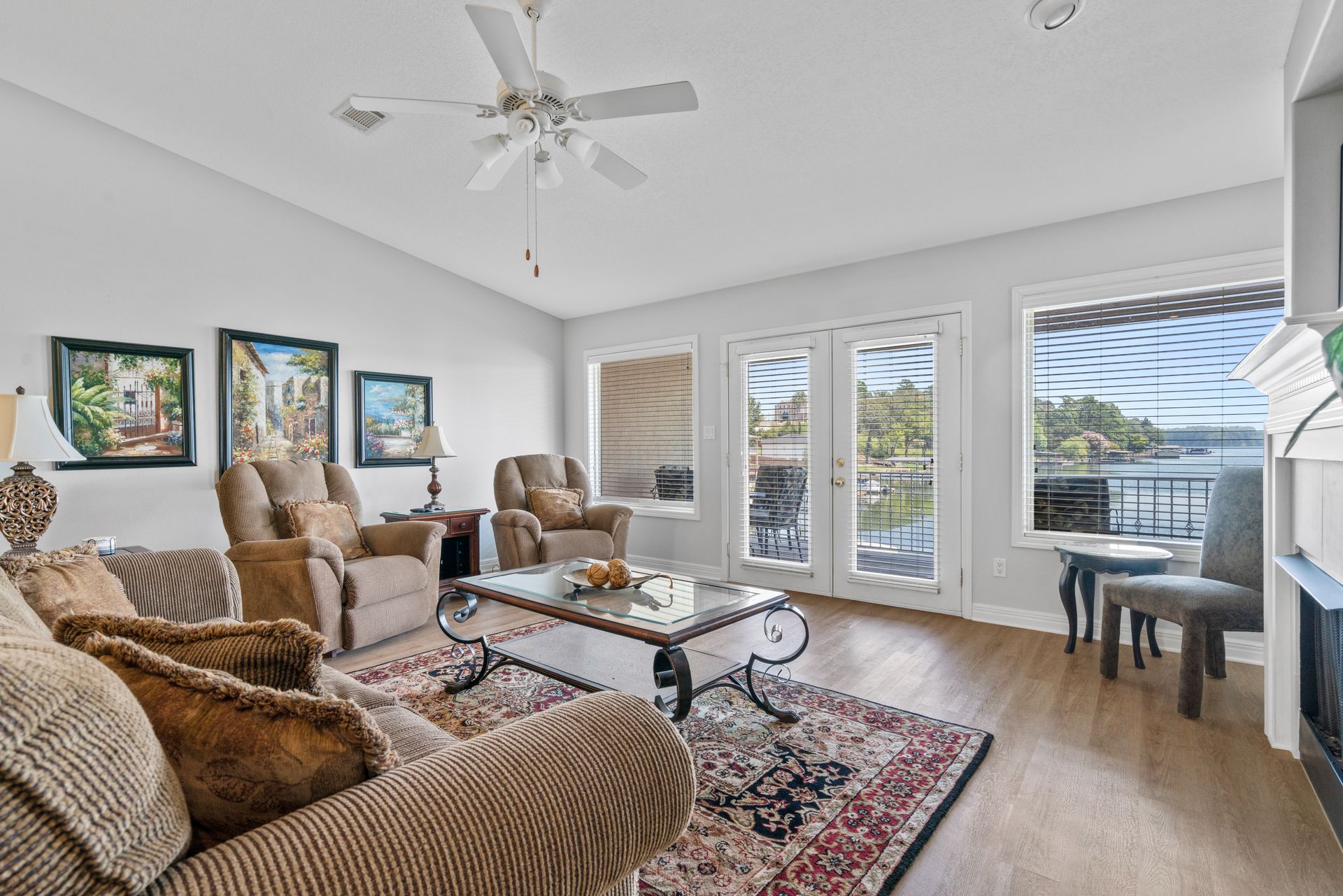 A living room filled with furniture and a ceiling fan.