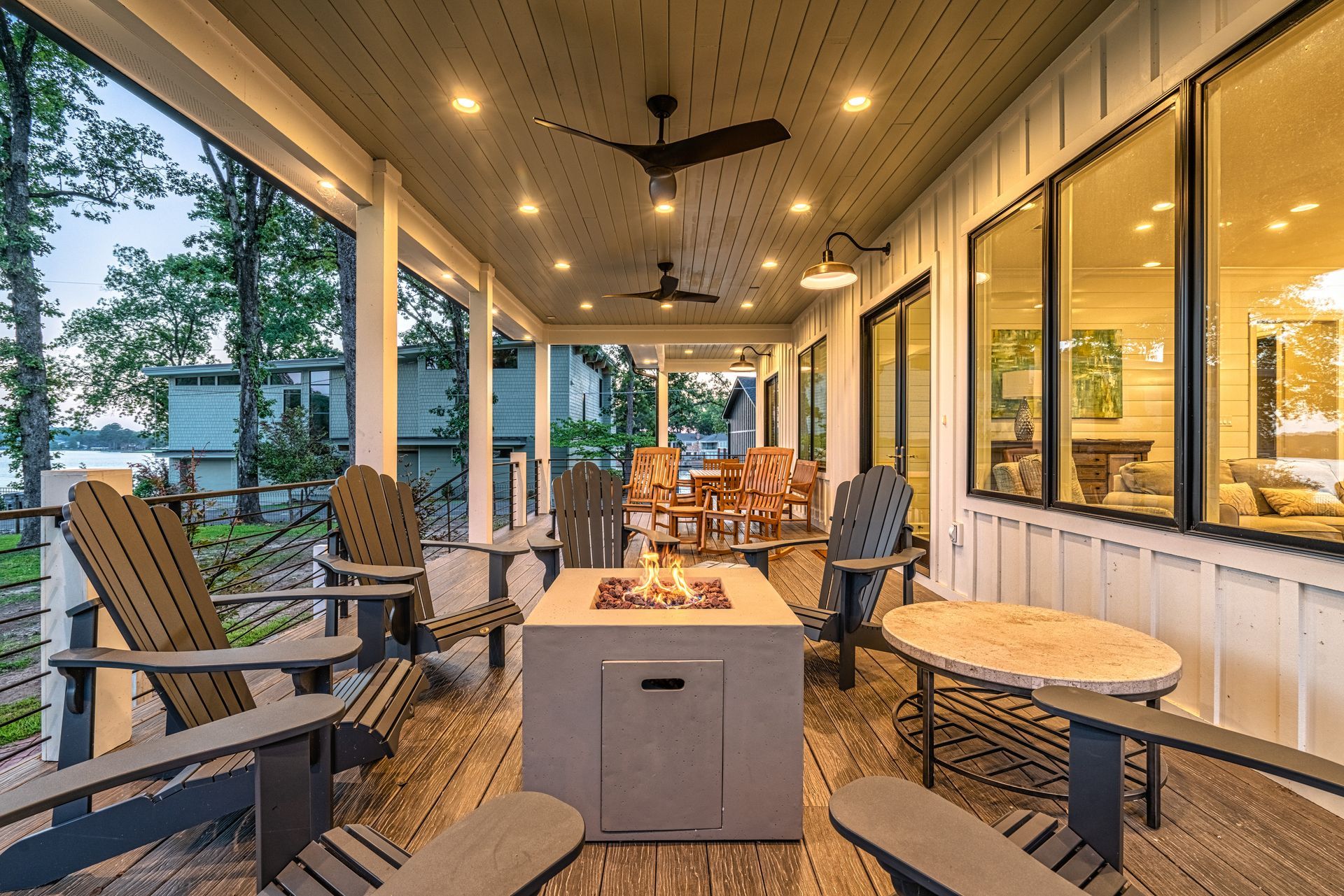 There is a fire pit on the porch of a house.