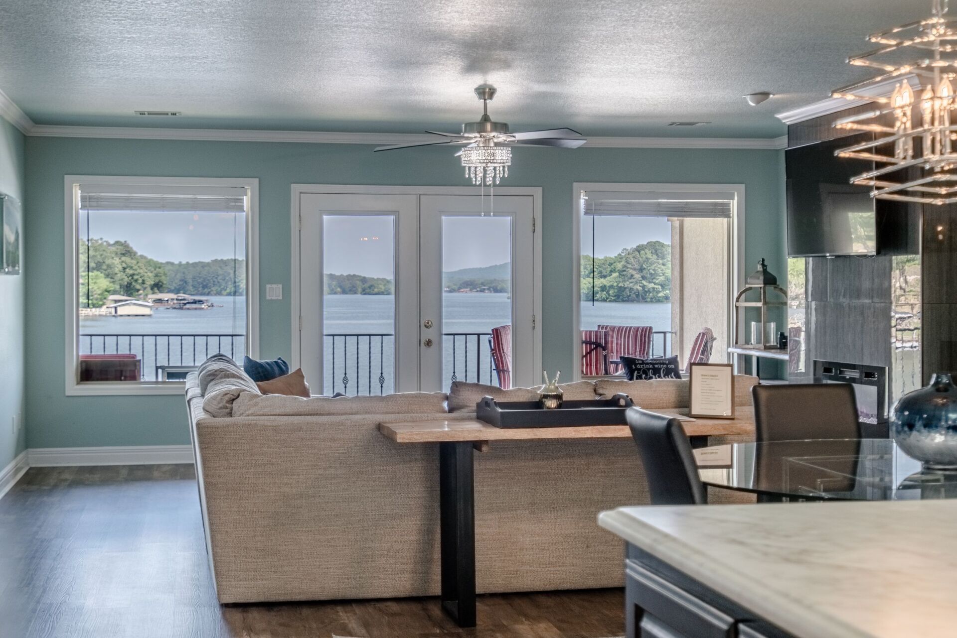 A living room with a view of a lake