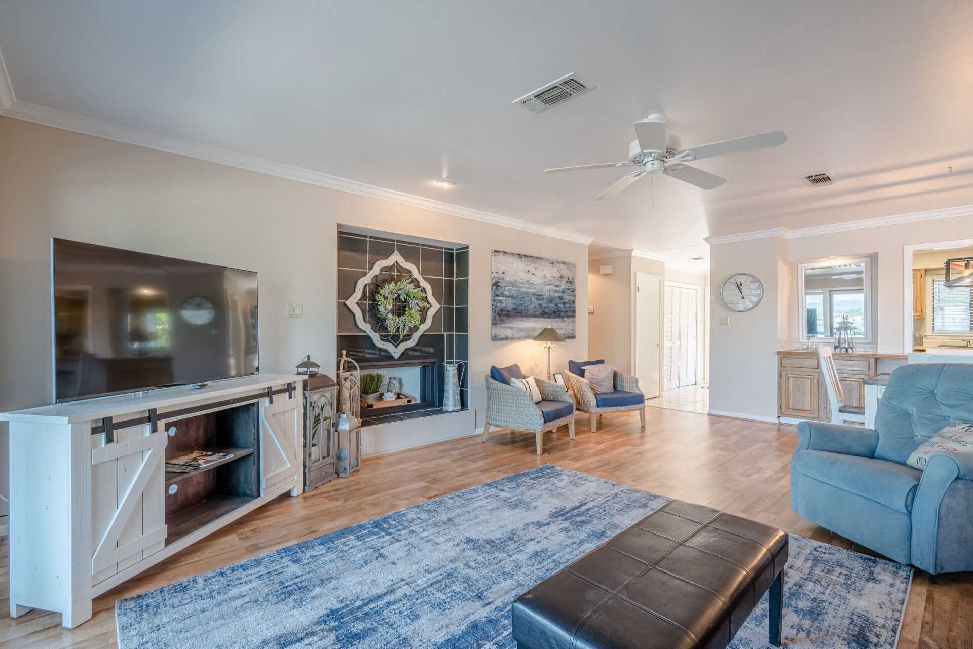 A living room filled with furniture and a flat screen tv.