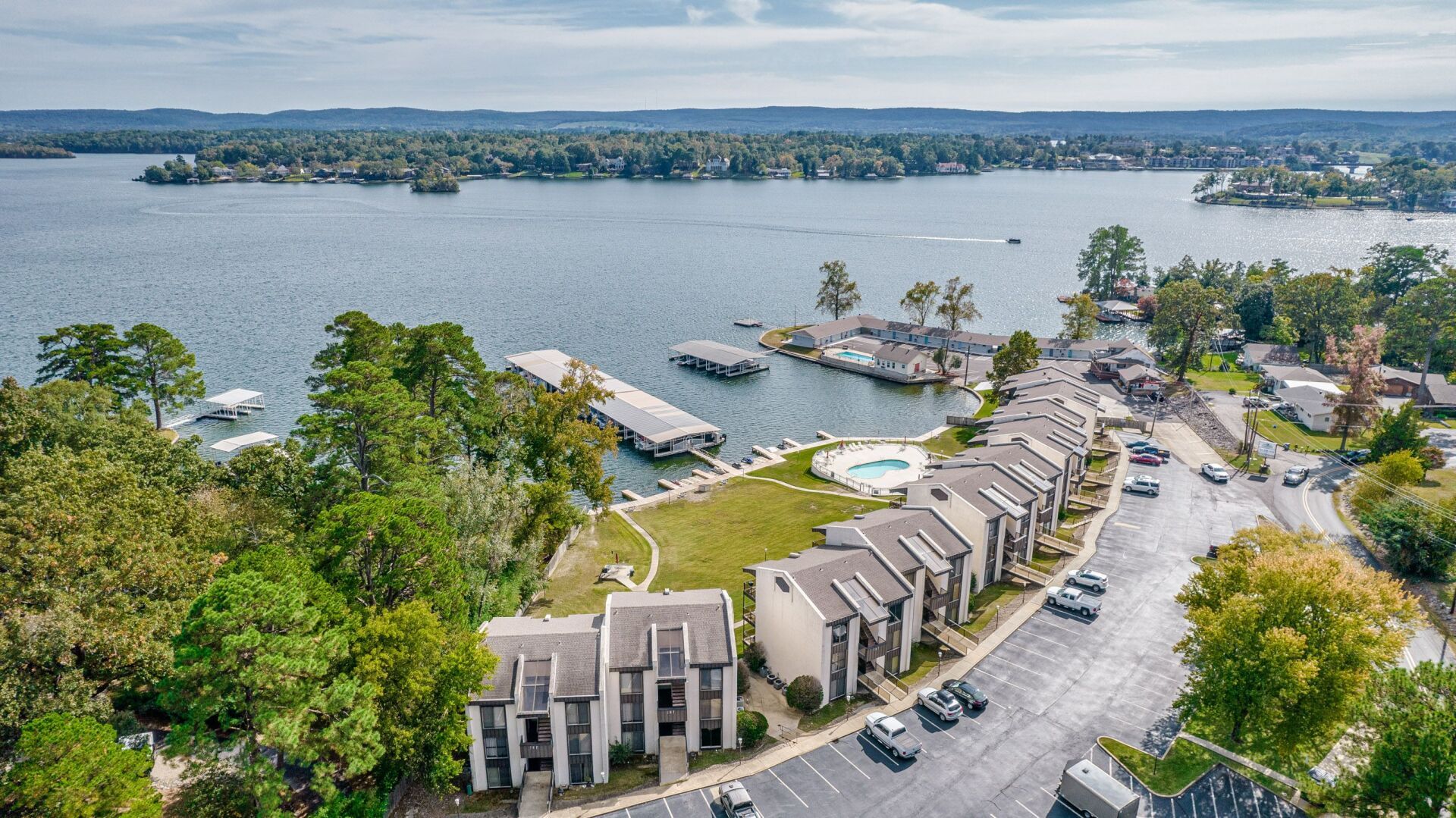 An aerial view of a residential area next to a lake.