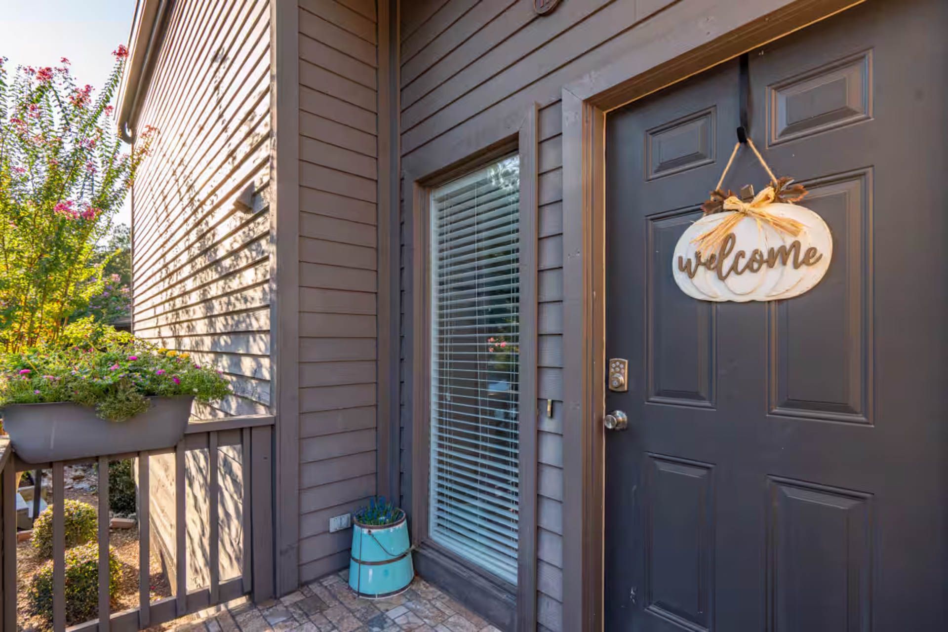 Exterior of a home with a dark gray door and a