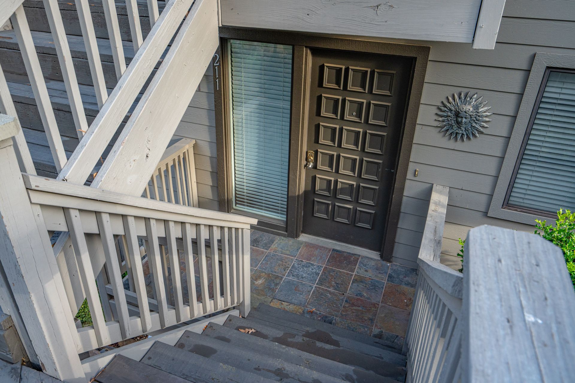 Stairs leading up to the front door of a house