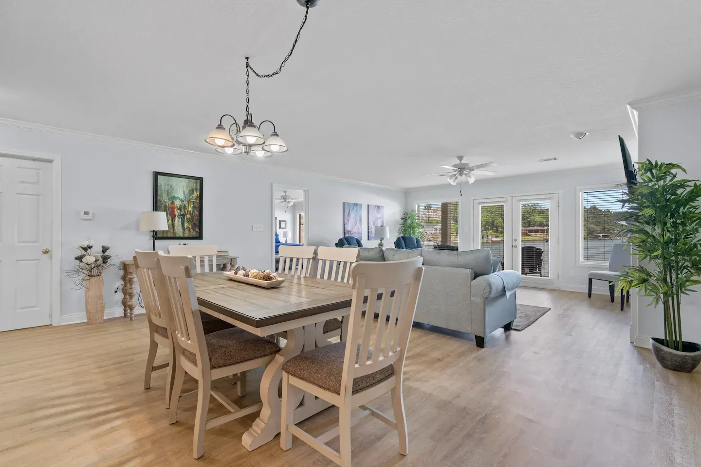 There is a dining table and chairs in the middle of the room.