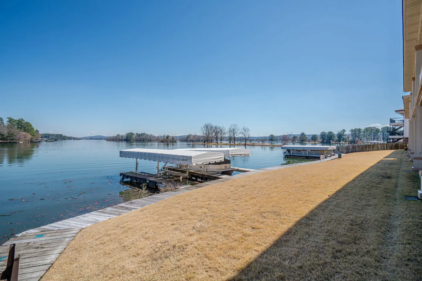 A large body of water with a dock in the middle of it.