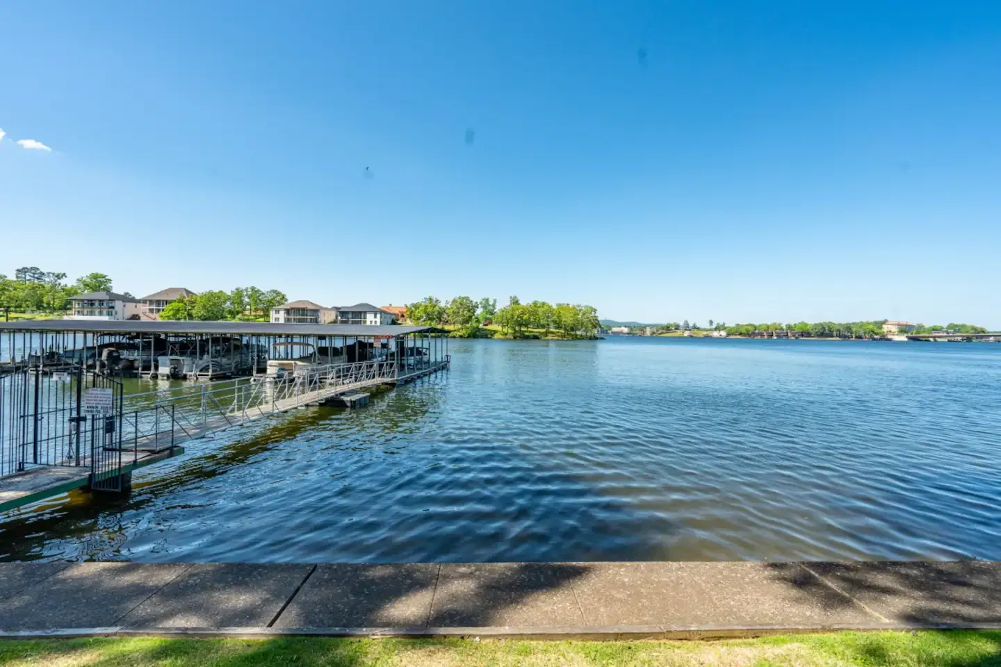 A large body of water with a dock in the middle of it.