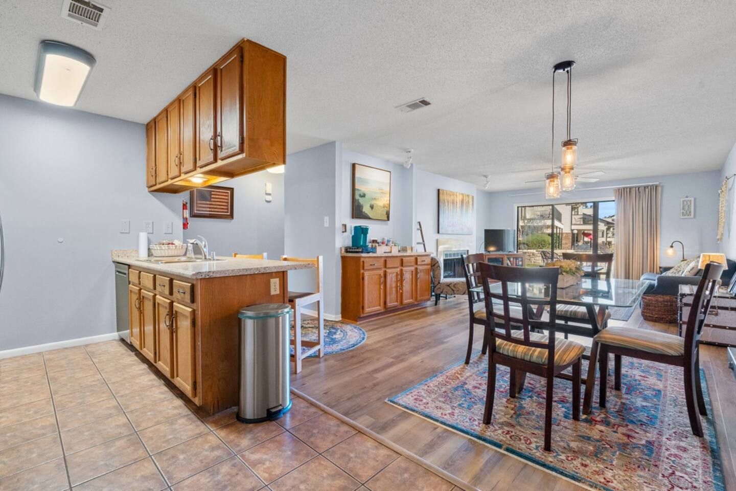 A kitchen , dining room and living room in a house.