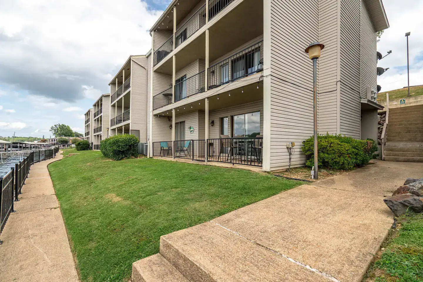 A large apartment building with stairs leading up to it.