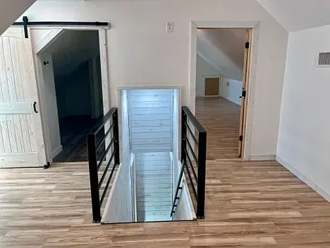 There is a staircase leading up to the second floor of a house.