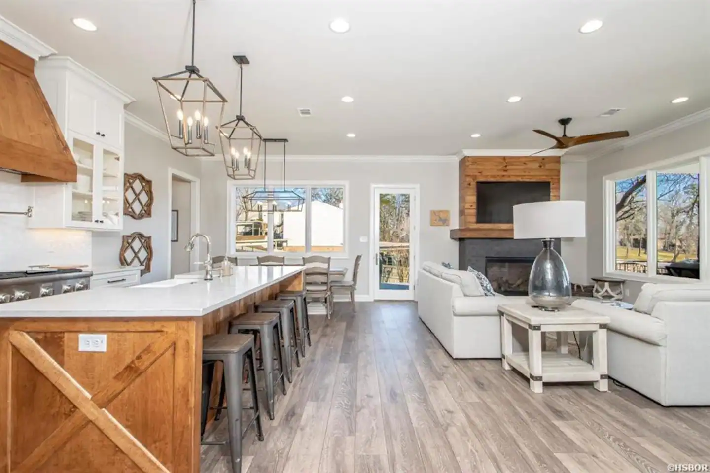 A kitchen , living room , and dining room in a house.