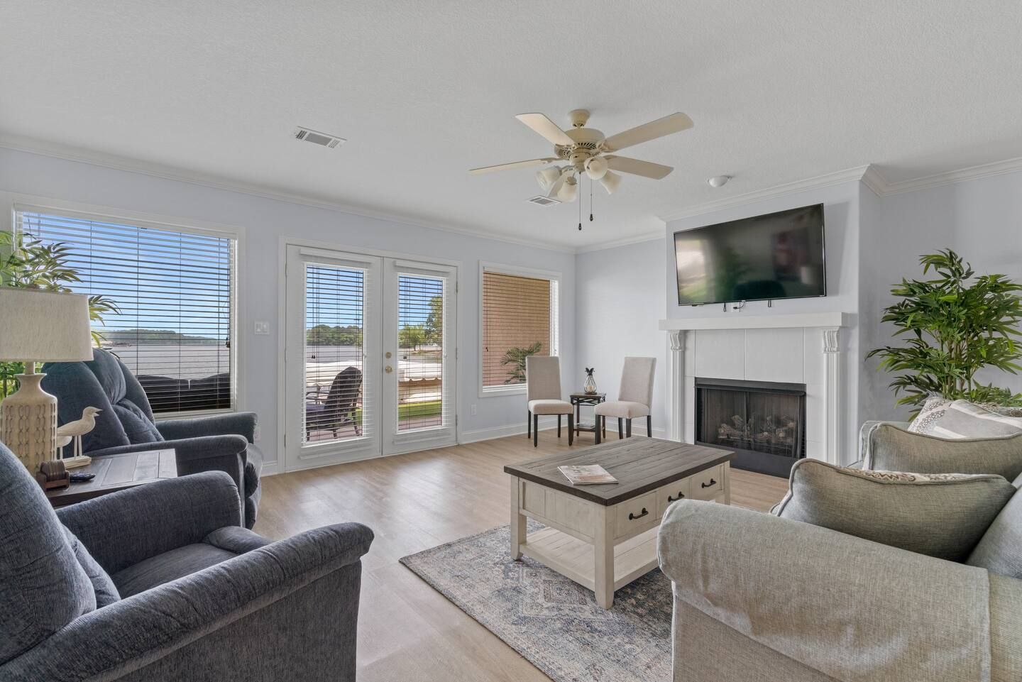 A living room filled with furniture and a fireplace.