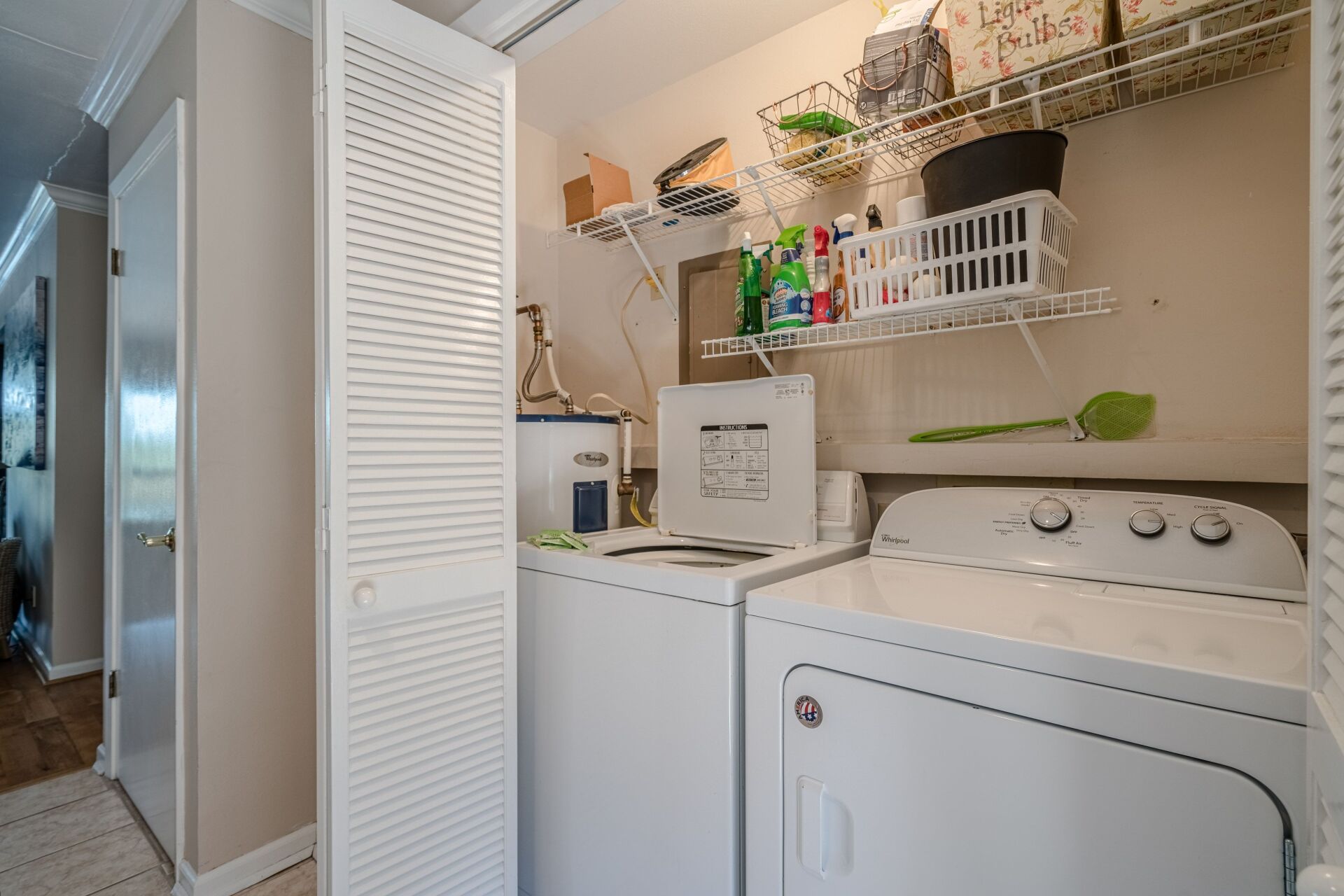 A laundry room with a washer and dryer in it.