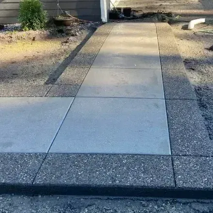 A concrete slab is sitting on top of a brick wall.
