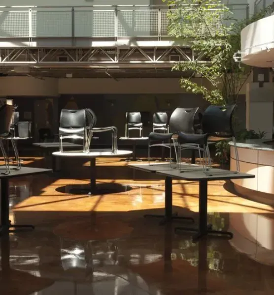 A room with tables and chairs in it