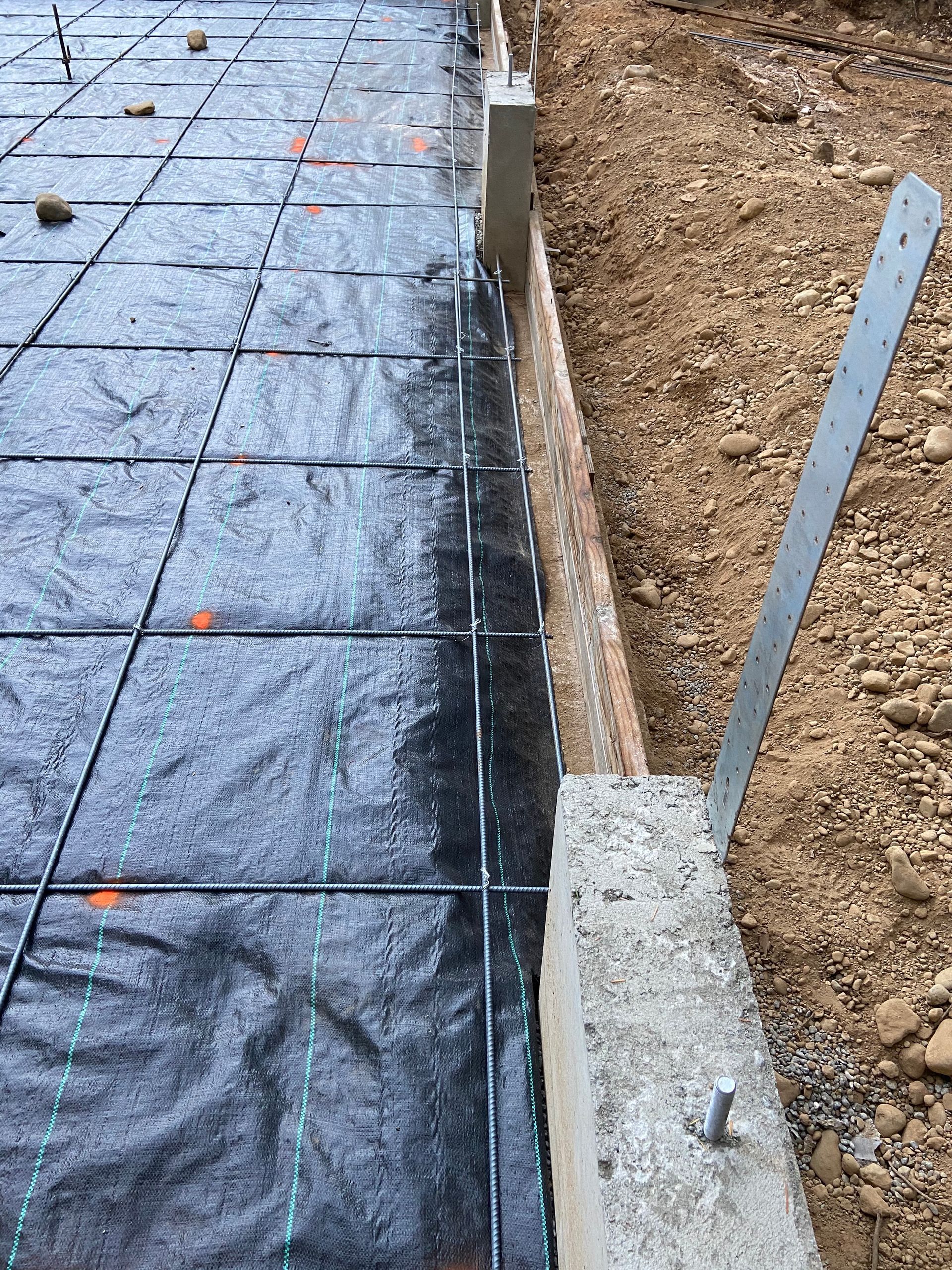 A close up of a concrete driveway under construction.