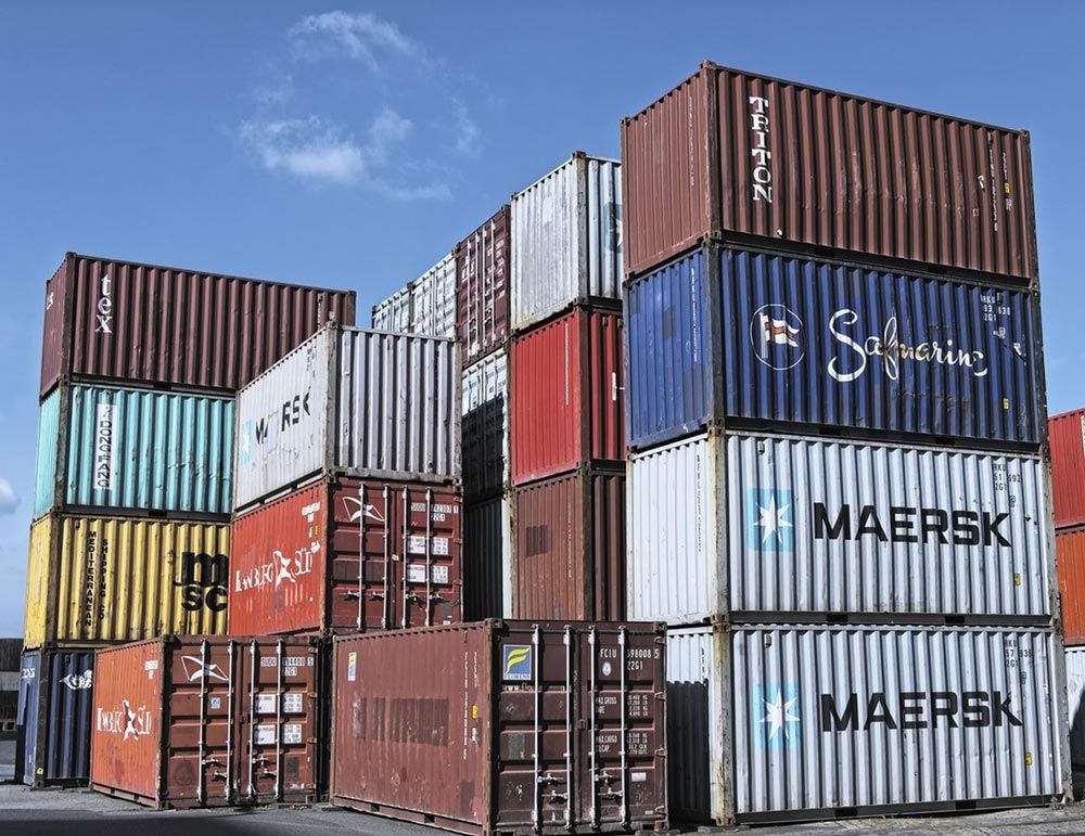 Many Shipping Containers Are Stacked On Top Of Each Other — Oz Shipping Containers in Teralba, NSW