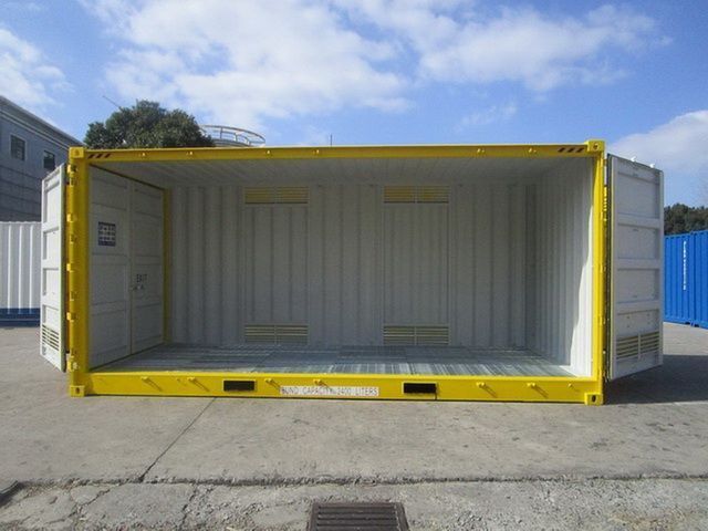 A Yellow And White Shipping Container Is Sitting In A Parking Lot — Oz Shipping Containers in Teralba, NSW