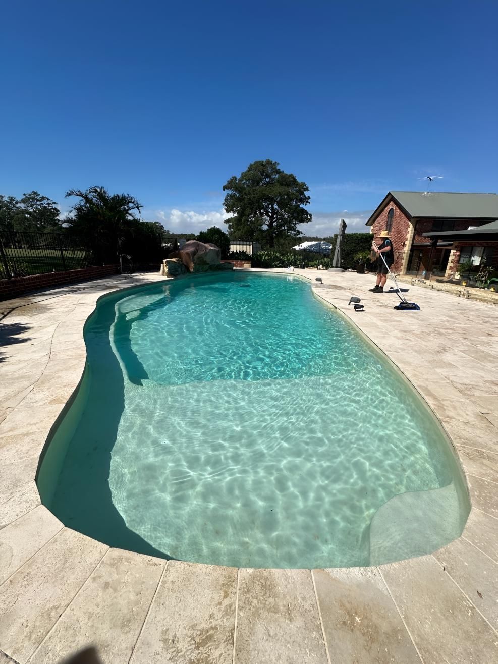 Pool in Taree being maintained by a man