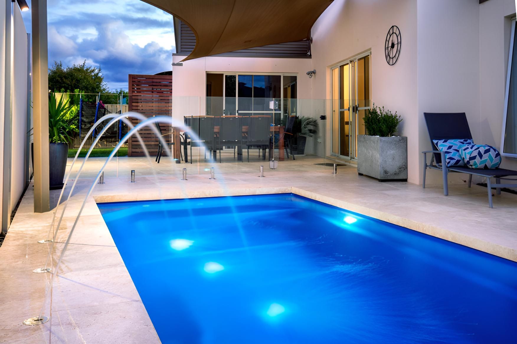 A Large Swimming Pool With a Fountain in the Middle of It — Taree Pool Supplies in Forster, NSW