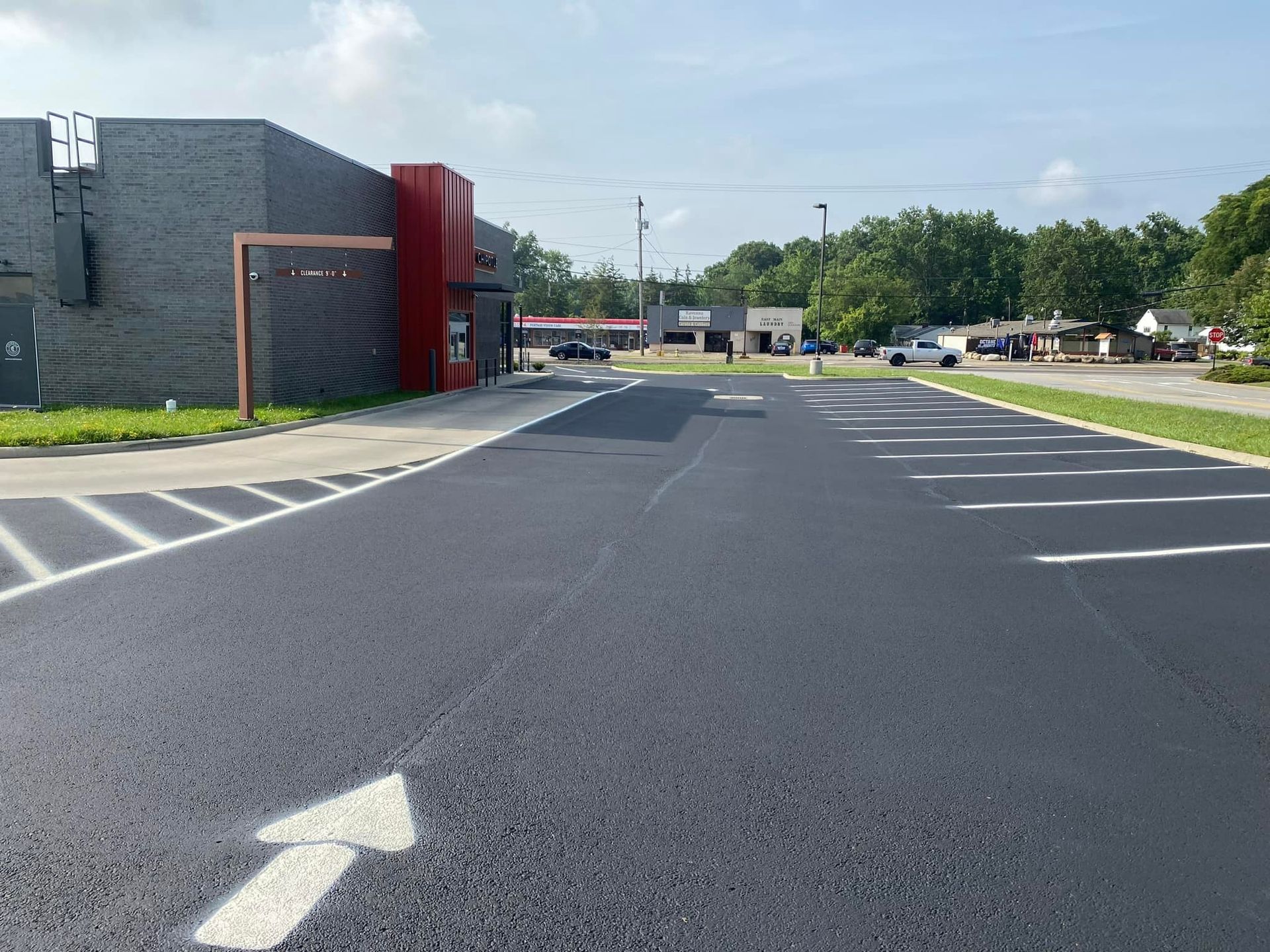 A parking lot with an arrow pointing to the right