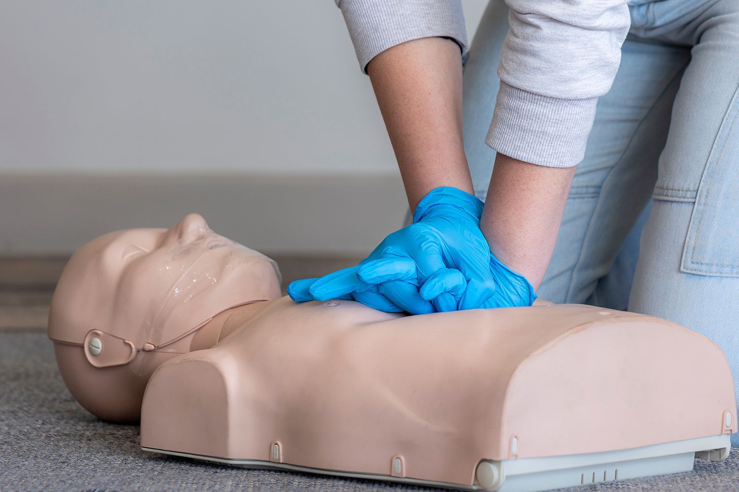 An instructor is demonstrating CPR technique.
