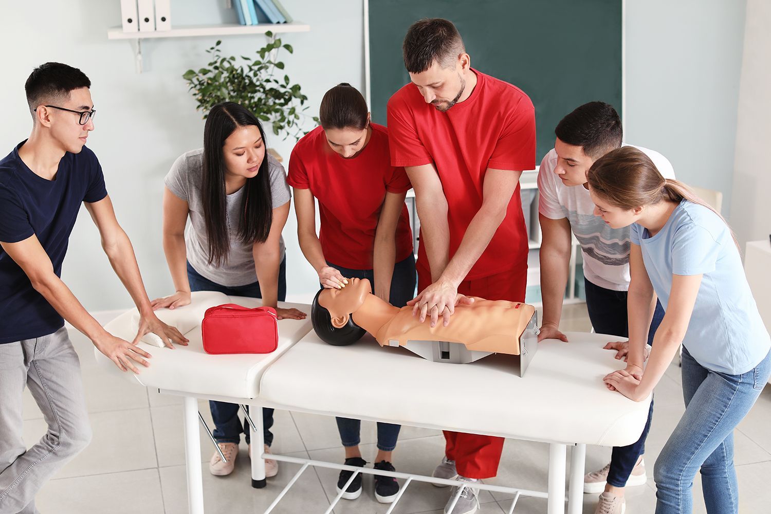 An instructor is giving a CPR course.