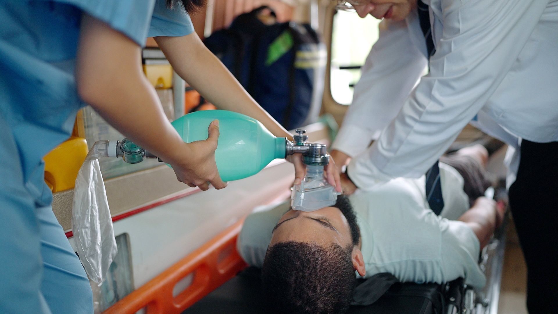 A man is receiving CPR training. A man is receiving CPR training.