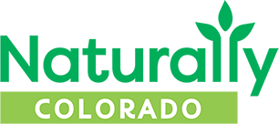 Naturally Colorado logo with green text and a leaf over a green bar