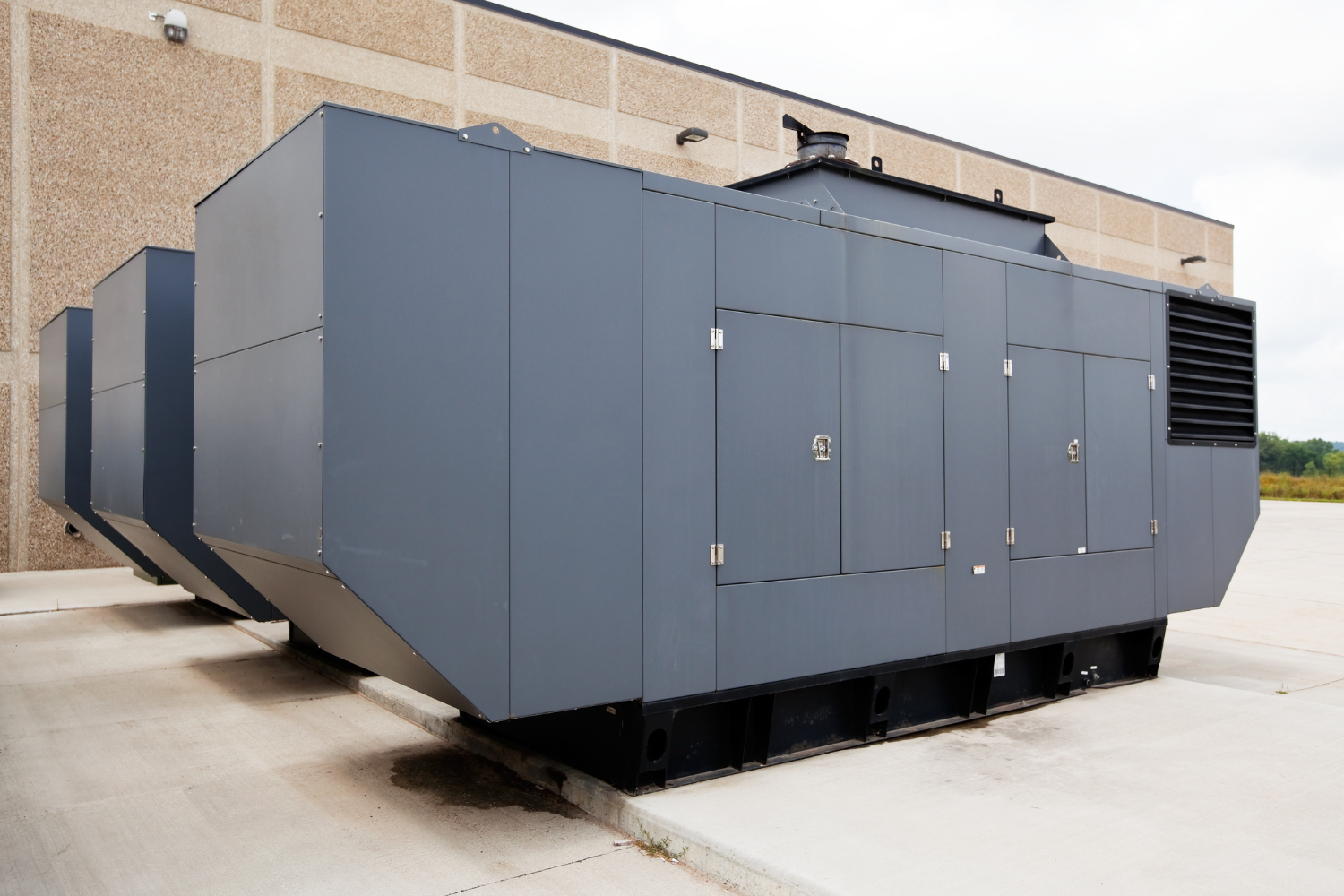Industrial backup power generator supported by custom wiring harnesses and cable assemblies for energy reliability.