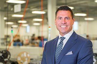 Kato Cable Chairman and CEO Eric Else standing in production facility