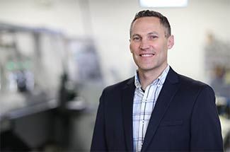 Kato Cable Quoting and Sales Engineering Manager Matt Lukasek standing in production facility