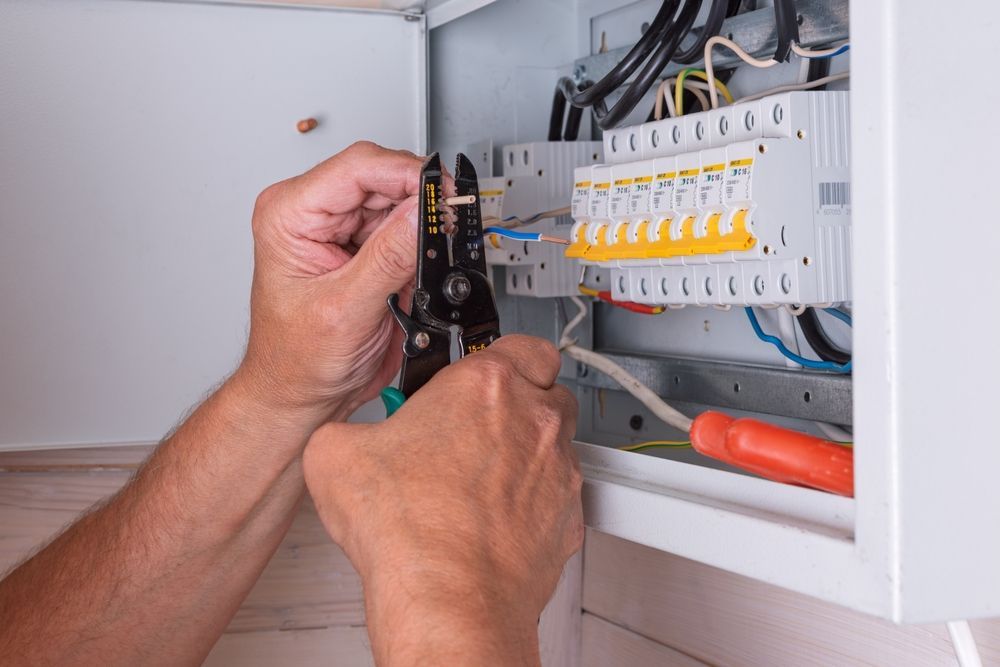 electrician manually processing wire