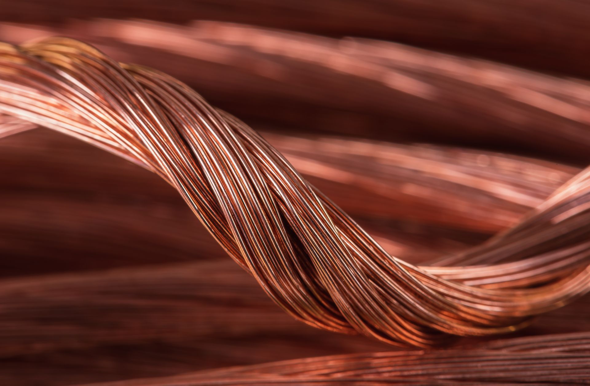 Close-up of braided copper wires used in manufacturing custom wiring harnesses and cable assemblies.