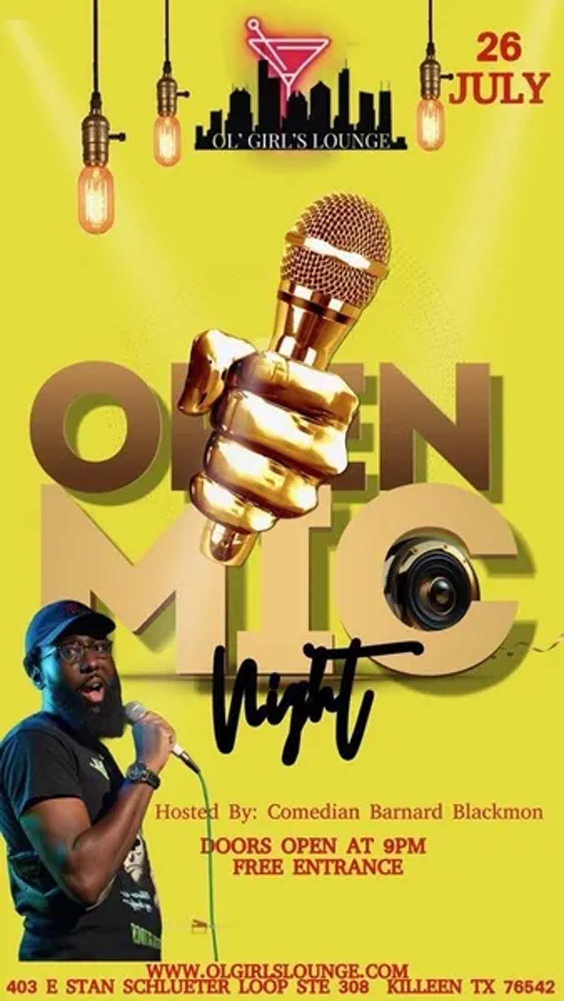 A man with a beard is holding a microphone in his hand.