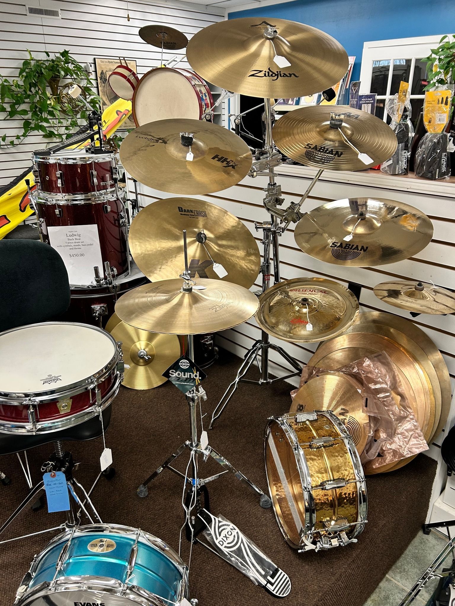 Drum set with several cymbals and a snare drum on display in a store.