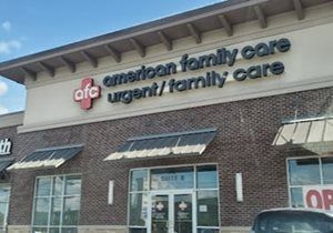 Exterior of an urgent family care clinic with brick facade and signage under a covered roofline