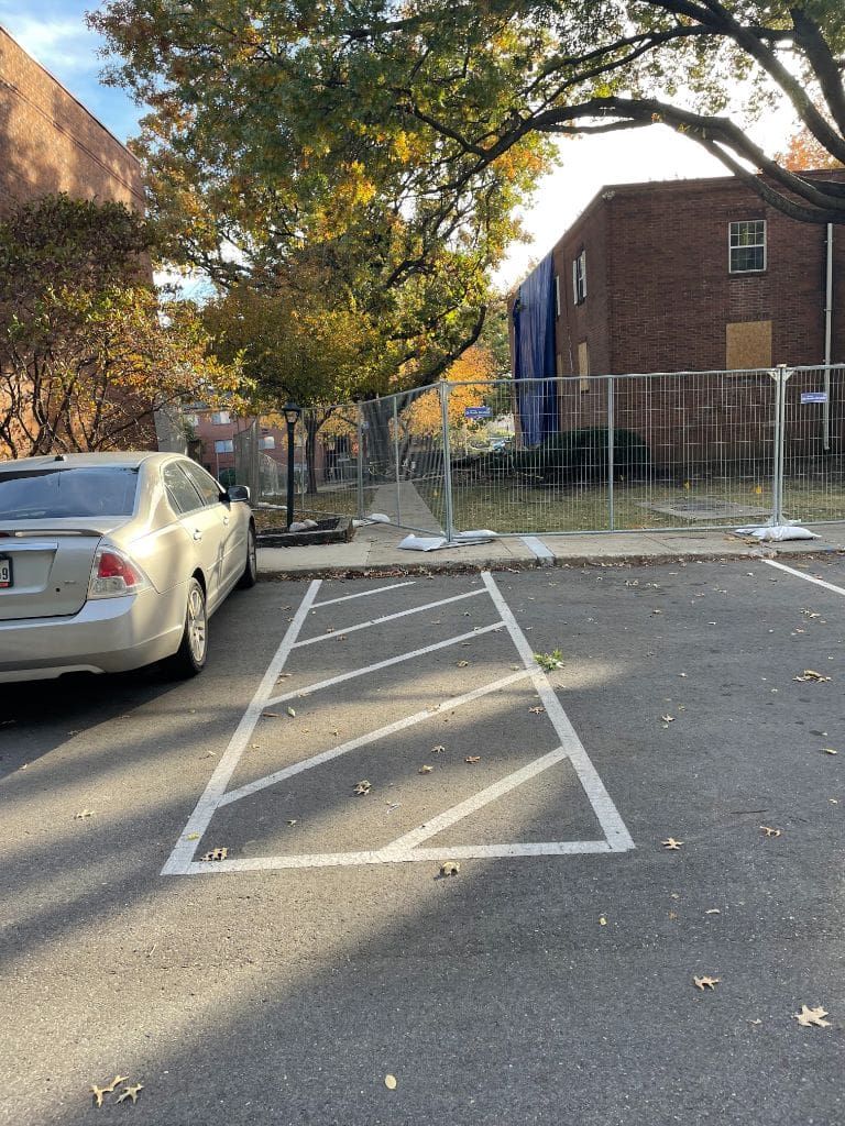 A car is parked in a handicapped parking spot.