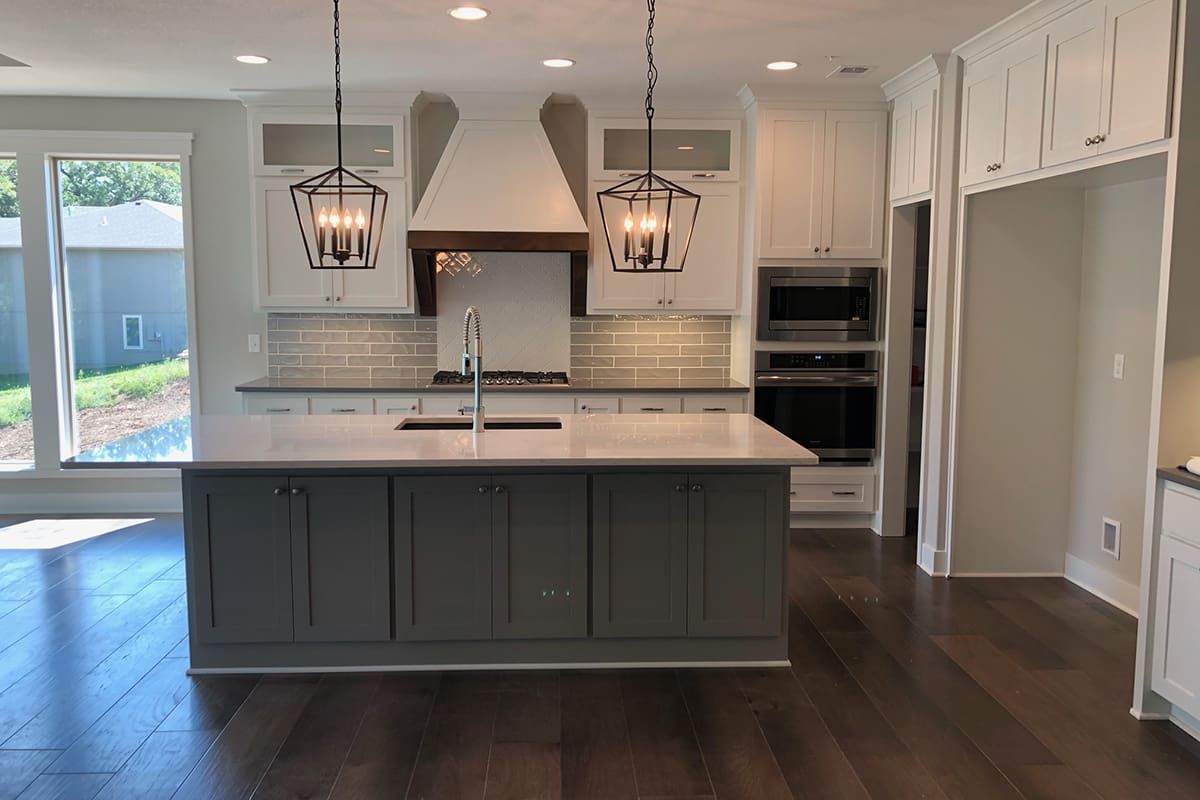 A kitchen with a large island in the middle of it.