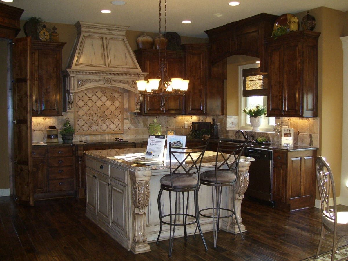 A kitchen with a large island and stools