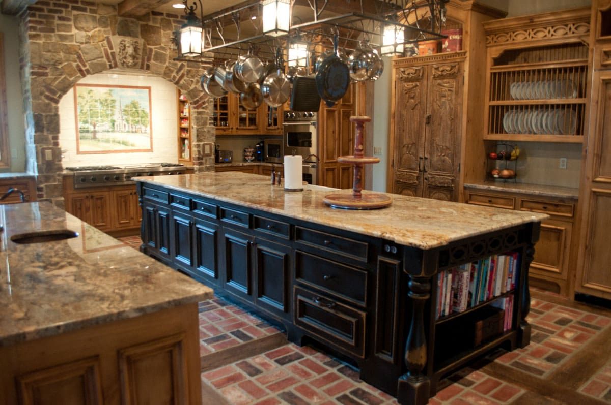 There is a large island in the middle of the kitchen.