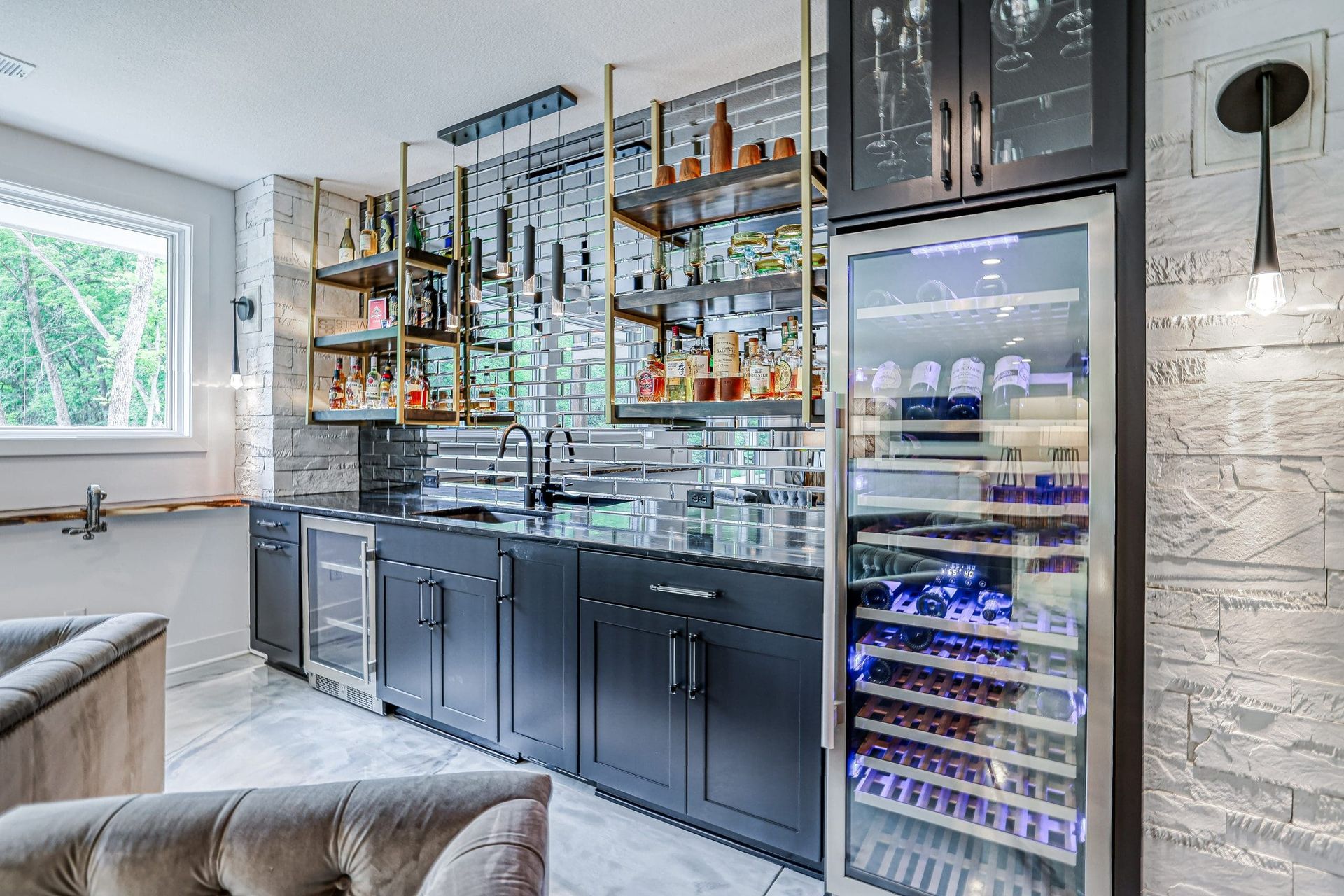 There is a large wine cooler in the middle of the room.