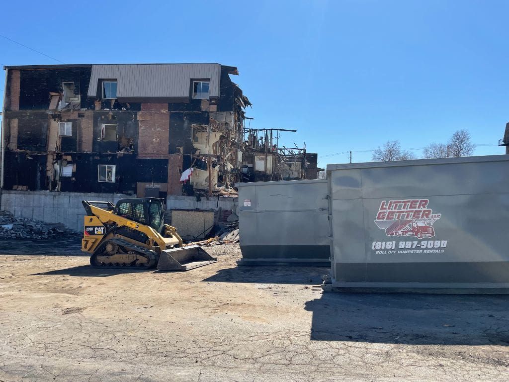 A bulldozer is being used to demolish a building.