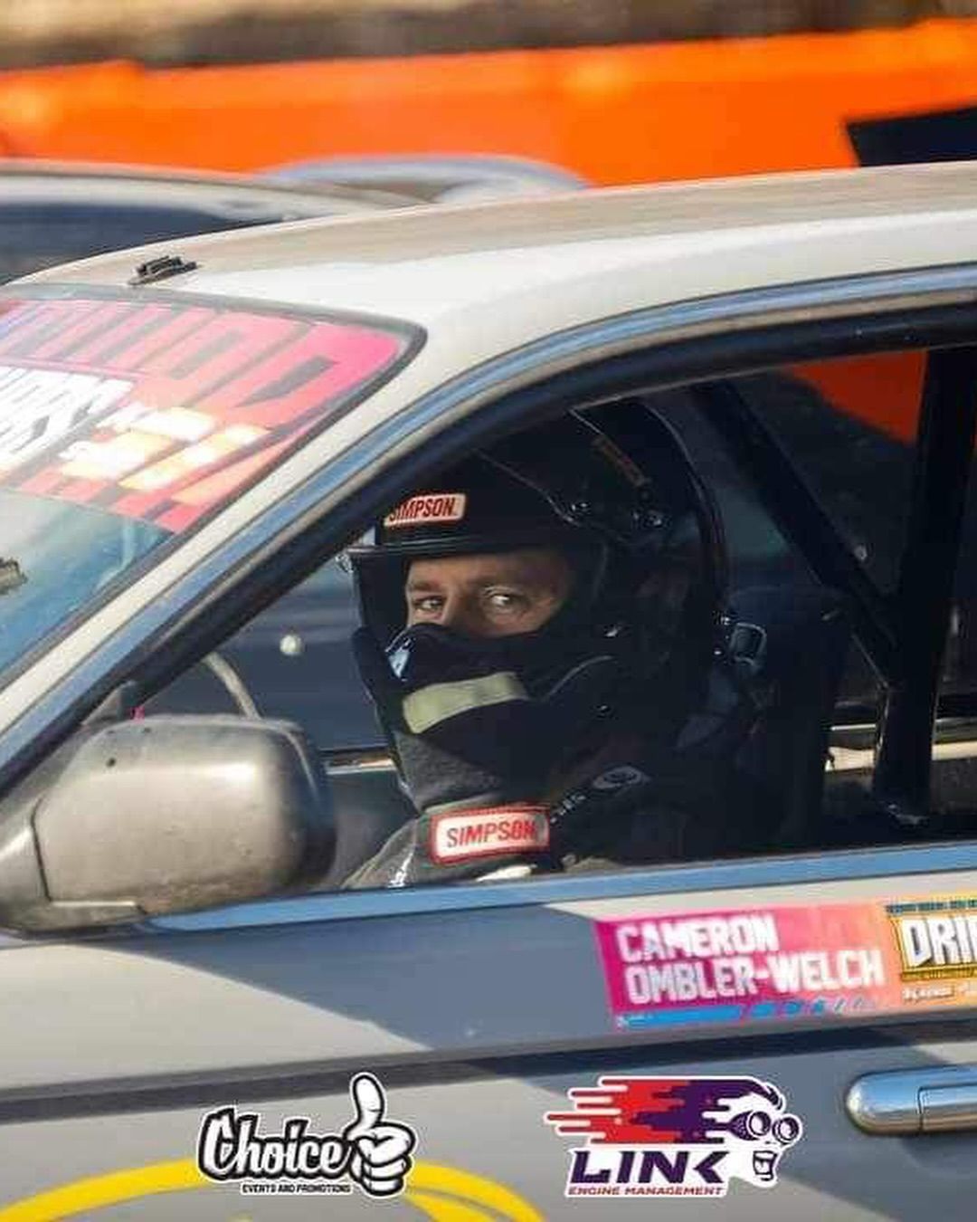 Cam sitting in car.